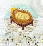 Kate Dickerson Needlepoint - Baby Jesus in Manger w/Clear Dome & Confetti